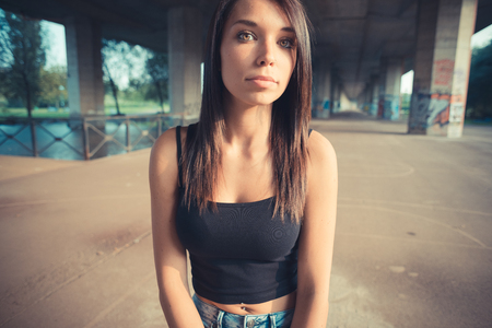 young beautiful brunette straight hair woman outdoorの写真素材