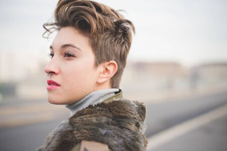young beautiful short hair hipster woman in town
