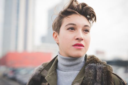 young beautiful short hair hipster woman in town