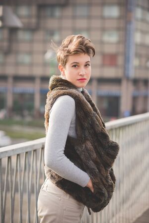 young beautiful short hair hipster woman in town