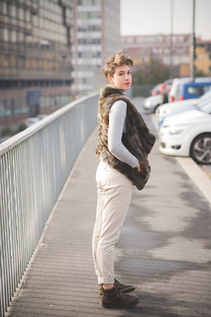 young beautiful short hair hipster woman in townの写真素材