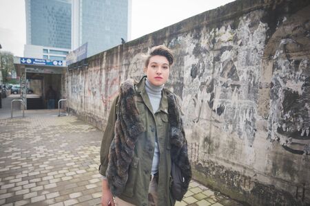 young beautiful short hair hipster woman in town