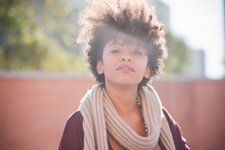 beautiful black curly hair african woman in townの写真素材