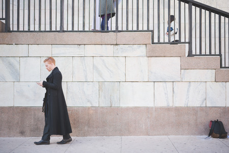 MILAN, ITALY - FEBRUARY 25: People during Milan Fashion week, Italy on February, 25 2015. Eccentric and fashionable people outside city during Milan fashion week wait for models and famous peopleのeditorial素材