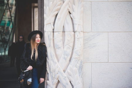 MILAN, ITALY - FEBRUARY 25: People during Milan Fashion week, Italy on February, 25 2015. Eccentric and fashionable people outside city during Milan fashion week wait for models and famous peopleのeditorial素材