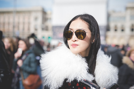 MILAN, ITALY - FEBRUARY 25: People during Milan Fashion week, Italy on February, 25 2015. Eccentric and fashionable people outside city during Milan fashion week wait for models and famous peopleのeditorial素材