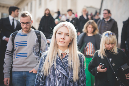 MILAN, ITALY - FEBRUARY 25: People during Milan Fashion week, Italy on February, 25 2015. Eccentric and fashionable people outside city during Milan fashion week wait for models and famous peopleのeditorial素材