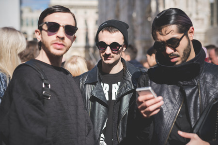 MILAN, ITALY - FEBRUARY 25: People during Milan Fashion week, Italy on February, 25 2015. Eccentric and fashionable people outside city during Milan fashion week wait for models and famous peopleのeditorial素材
