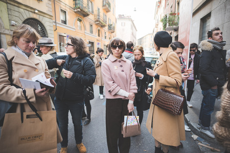 MILAN, ITALY - FEBRUARY 27: People during Milan Fashion week, Italy on February, 27 2015. Eccentric and fashionable people outside city during Milan fashion week wait for models and famous peopleのeditorial素材