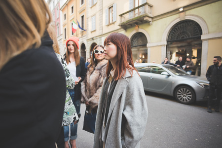 MILAN, ITALY - FEBRUARY 27: People during Milan Fashion week, Italy on February, 27 2015. Eccentric and fashionable people outside city during Milan fashion week wait for models and famous peopleのeditorial素材