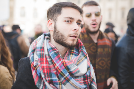 MILAN, ITALY - FEBRUARY 25: People during Milan Fashion week, Italy on February, 25 2015. Eccentric and fashionable people outside city during Milan fashion week wait for models and famous peopleのeditorial素材