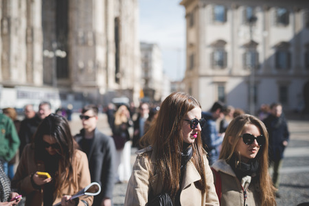 MILAN, ITALY - FEBRUARY 25: People during Milan Fashion week, Italy on February, 25 2015. Eccentric and fashionable people outside city during Milan fashion week wait for models and famous peopleのeditorial素材