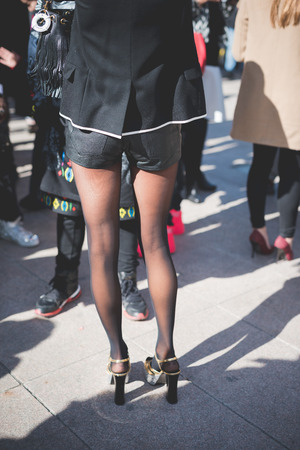 MILAN, ITALY - FEBRUARY 25: People during Milan Fashion week, Italy on February, 25 2015. Eccentric and fashionable people outside city during Milan fashion week wait for models and famous peopleのeditorial素材