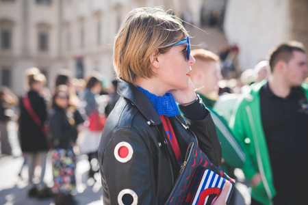 MILAN, ITALY - FEBRUARY 25: People during Milan Fashion week, Italy on February, 25 2015. Eccentric and fashionable people outside city during Milan fashion week wait for models and famous peopleのeditorial素材