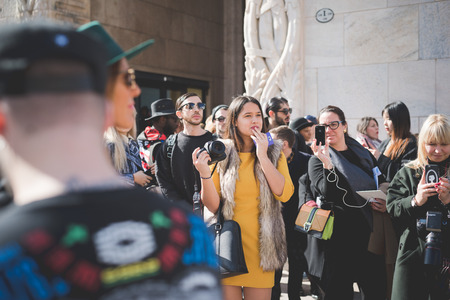 MILAN, ITALY - FEBRUARY 25: People during Milan Fashion week, Italy on February, 25 2015. Eccentric and fashionable people outside city during Milan fashion week wait for models and famous peopleのeditorial素材