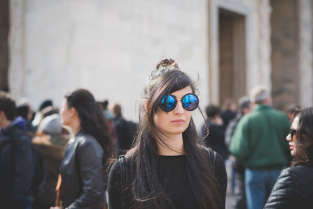 MILAN, ITALY - FEBRUARY 25: People during Milan Fashion week, Italy on February, 25 2015. Eccentric and fashionable people outside city during Milan fashion week wait for models and famous peopleのeditorial素材