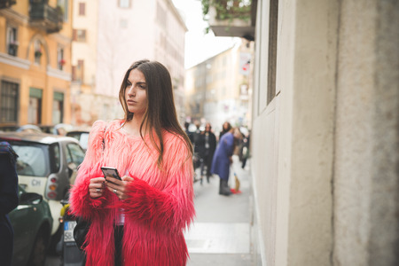 MILAN, ITALY - FEBRUARY 27: People during Milan Fashion week, Italy on February, 27 2015. Eccentric and fashionable people outside city during Milan fashion week wait for models and famous peopleのeditorial素材