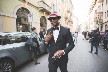 MILAN, ITALY - FEBRUARY 27: People during Milan Fashion week, Italy on February, 27 2015. Eccentric and fashionable people outside city during Milan fashion week wait for models and famous peopleのeditorial素材