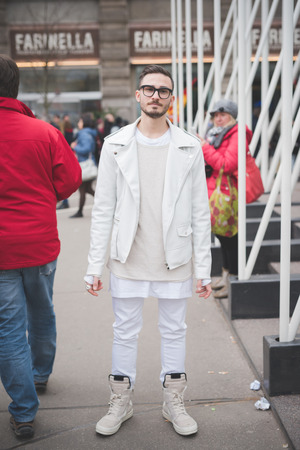 MILAN, ITALY - FEBRUARY 28: People during Milan Fashion week, Italy on February, 28 2015. Eccentric and fashionable people outside city during Milan fashion week wait for models and famous peopleのeditorial素材