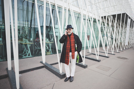 MILAN, ITALY - FEBRUARY 28: People during Milan Fashion week, Italy on February, 28 2015. Eccentric and fashionable people outside city during Milan fashion week wait for models and famous peopleのeditorial素材