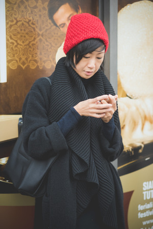 MILAN, ITALY - FEBRUARY 28: People during Milan Fashion week, Italy on February, 28 2015. Eccentric and fashionable people outside city during Milan fashion week wait for models and famous peopleのeditorial素材