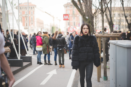 MILAN, ITALY - FEBRUARY 28: People during Milan Fashion week, Italy on February, 28 2015. Eccentric and fashionable people outside city during Milan fashion week wait for models and famous peopleのeditorial素材