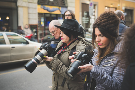 MILAN, ITALY - FEBRUARY 27: People during Milan Fashion week, Italy on February, 27 2015. Eccentric and fashionable people outside city during Milan fashion week wait for models and famous peopleのeditorial素材