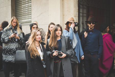 MILAN, ITALY - FEBRUARY 27: People during Milan Fashion week, Italy on February, 27 2015. Eccentric and fashionable people outside city during Milan fashion week wait for models and famous peopleのeditorial素材