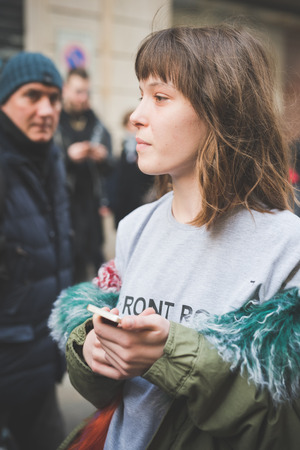 MILAN, ITALY - FEBRUARY 27: People during Milan Fashion week, Italy on February, 27 2015. Eccentric and fashionable people outside city during Milan fashion week wait for models and famous peopleのeditorial素材