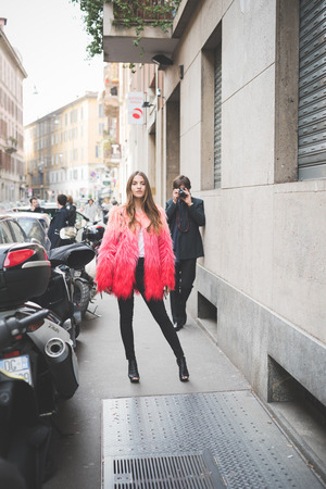 MILAN, ITALY - FEBRUARY 27: People during Milan Fashion week, Italy on February, 27 2015. Eccentric and fashionable people outside city during Milan fashion week wait for models and famous peopleのeditorial素材