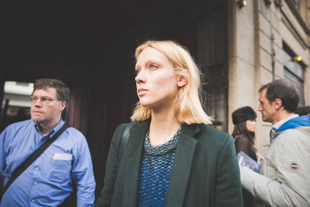 MILAN, ITALY - FEBRUARY 27: People during Milan Fashion week, Italy on February, 27 2015. Eccentric and fashionable people outside city during Milan fashion week wait for models and famous peopleのeditorial素材