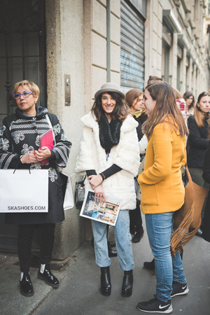 MILAN, ITALY - FEBRUARY 27: People during Milan Fashion week, Italy on February, 27 2015. Eccentric and fashionable people outside city during Milan fashion week wait for models and famous peopleのeditorial素材