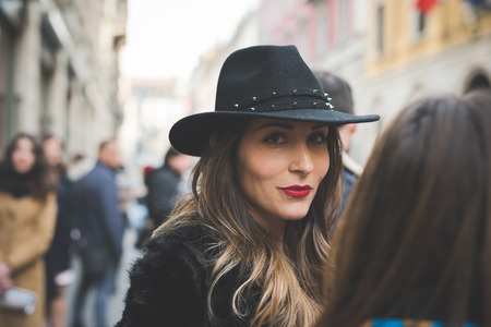 MILAN, ITALY - FEBRUARY 27: People during Milan Fashion week, Italy on February, 27 2015. Eccentric and fashionable people outside city during Milan fashion week wait for models and famous peopleのeditorial素材