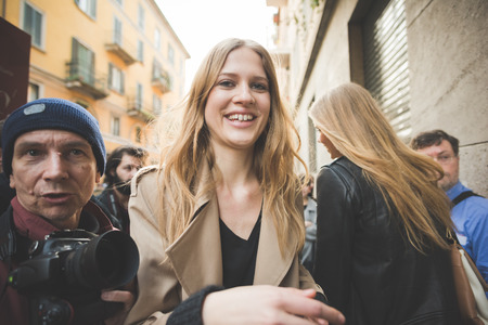 MILAN, ITALY - FEBRUARY 27: People during Milan Fashion week, Italy on February, 27 2015. Eccentric and fashionable people outside city during Milan fashion week wait for models and famous peopleのeditorial素材