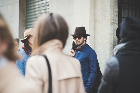 MILAN, ITALY - FEBRUARY 27: People during Milan Fashion week, Italy on February, 27 2015. Eccentric and fashionable people outside city during Milan fashion week wait for models and famous peopleのeditorial素材