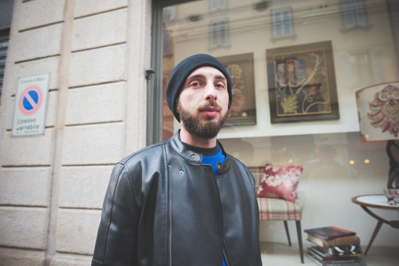 MILAN, ITALY - FEBRUARY 27: People during Milan Fashion week, Italy on February, 27 2015. Eccentric and fashionable people outside city during Milan fashion week wait for models and famous peopleのeditorial素材