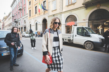 MILAN, ITALY - FEBRUARY 27: People during Milan Fashion week, Italy on February, 27 2015. Eccentric and fashionable people outside city during Milan fashion week wait for models and famous peopleのeditorial素材