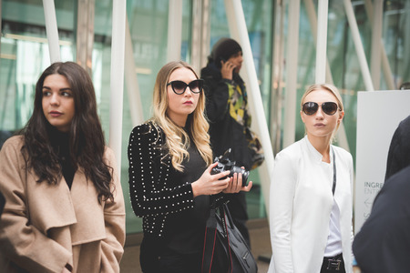 MILAN, ITALY - FEBRUARY 28: People during Milan Fashion week, Italy on February, 28 2015. Eccentric and fashionable people outside city during Milan fashion week wait for models and famous peopleのeditorial素材