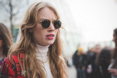 MILAN, ITALY - FEBRUARY 28: People during Milan Fashion week, Italy on February, 28 2015. Eccentric and fashionable people outside city during Milan fashion week wait for models and famous peopleのeditorial素材