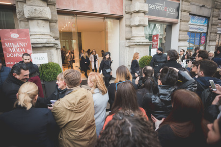 MILAN, ITALY - FEBRUARY 28: People during Milan Fashion week, Italy on February, 28 2015. Eccentric and fashionable people outside city during Milan fashion week wait for models and famous peopleのeditorial素材