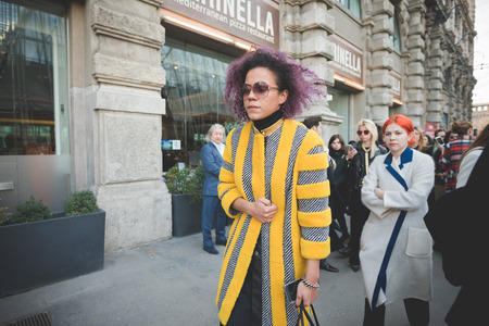 MILAN, ITALY - FEBRUARY 28: People during Milan Fashion week, Italy on February, 28 2015. Eccentric and fashionable people outside city during Milan fashion week wait for models and famous peopleのeditorial素材