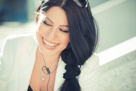 beautiful long black hair elegant business woman using smartphone  in the cityの写真素材