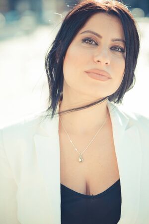 beautiful long black hair elegant business woman in the cityの写真素材