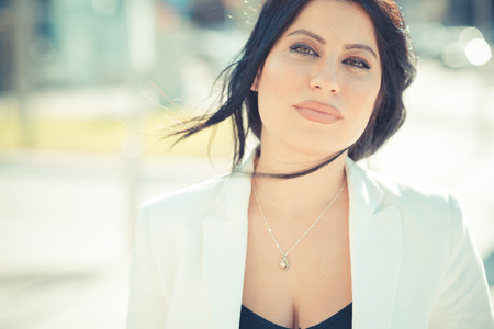 beautiful long black hair elegant business woman in the cityの写真素材