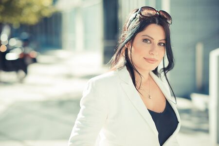 beautiful long black hair elegant business woman in the cityの写真素材