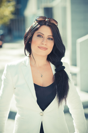 beautiful long black hair elegant business woman in the cityの写真素材