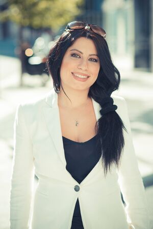 beautiful long black hair elegant business woman in the cityの写真素材