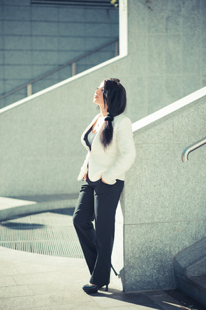 beautiful long black hair elegant business woman in the cityの写真素材
