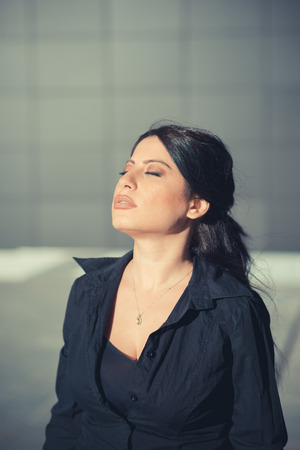 beautiful long black hair elegant business woman in the cityの写真素材
