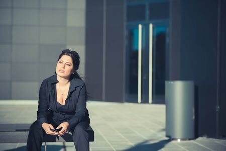 beautiful long black hair elegant business woman in the cityの写真素材
